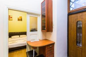 Ліжко або ліжка в номері Квартира подобово у центрі Львова вулиця Замарстинівська 5