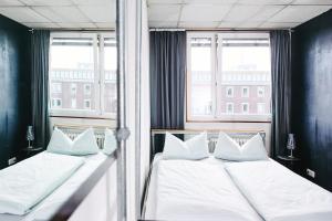 Postel nebo postele na pokoji v ubytování Sleep Station Hostel