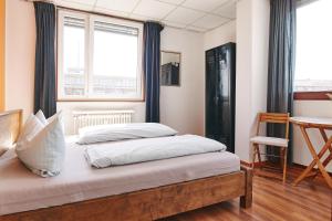 Postel nebo postele na pokoji v ubytování Sleep Station Hostel