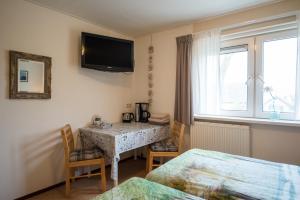 TV a/nebo společenská místnost v ubytování B&B Molenaar