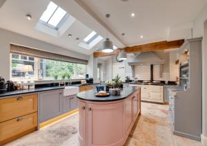 a large kitchen with a large island in the middle at Church Beck Retreat in Scalby