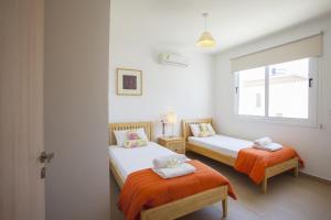 Ένα ή περισσότερα κρεβάτια σε δωμάτιο στο Villa Daffodil 