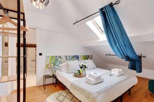 Ліжко або ліжка в номері Amazing apartment 1BR6P - Batignolles
