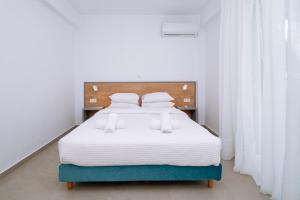 Letto o letti in una camera di Danai & Palm Residential Complexes