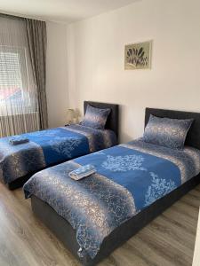 Ένα ή περισσότερα κρεβάτια σε δωμάτιο στο Apartman Drina