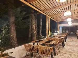 a row of tables and chairs on a patio at Aegean Pearl in Tigaki