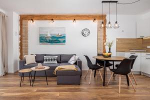 a living room with a couch and a table at Apartman Roko in Vrata