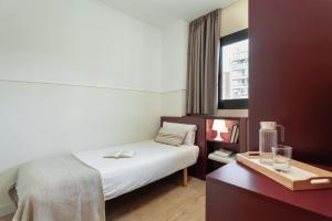 Posteľ alebo postele v izbe v ubytovaní Apartments Sata Olimpic Village Area