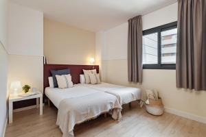Posteľ alebo postele v izbe v ubytovaní Apartments Sata Olimpic Village Area
