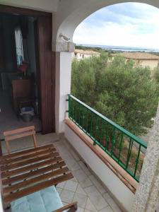 a balcony with a bench and a view at Da Teresa in San Teodoro