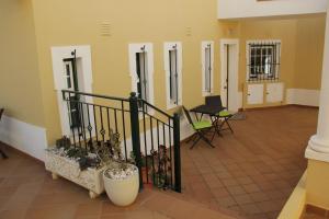 a room with a balcony with chairs and a table at Dias Sublimes in Porches