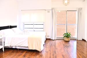 Un pat sau paturi într-o cameră la Moderno y Selecto! Buenos Aires - Villa Urquiza