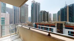 a balcony with a view of a city skyline at Key View - Al Majara in Dubai