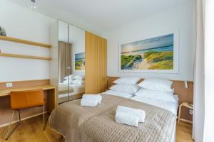 Posteľ alebo postele v izbe v ubytovaní Apartament DUNE SurfingBird Dźwirzyno