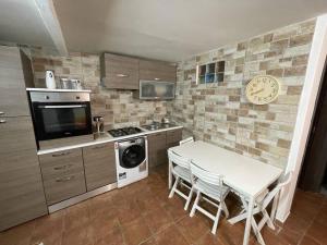 Kuchyň nebo kuchyňský kout v ubytování Xenia renting