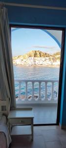 a view of the water from a cruise ship window at P i g a d i a B a y in Karpathos Town