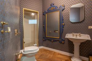a bathroom with a toilet and a sink at Duomo Smart Suites in Milan