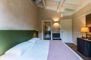 Voodi või voodid majutusasutuse Relais Le Coste toas