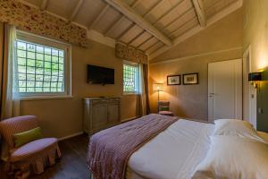 Voodi või voodid majutusasutuse Relais Le Coste toas