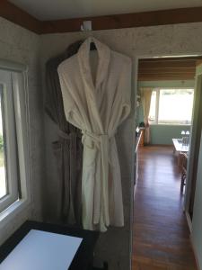 a robe hanging on the wall of a room at Zilver'n Plekkie in Zeyen