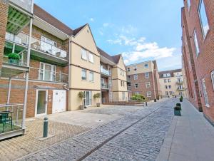 a cobblestone street in an apartment complex at Roman Quarter , Chichester in Chichester