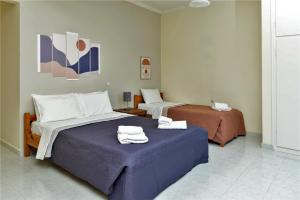 A bed or beds in a room at Zois Apartments