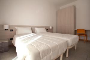 Кровать или кровати в номере Residence Le Querce