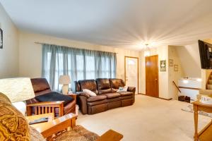 a living room with a leather couch at Clear Lake Vacation Home Rental - Pet Friendly! in Clear Lake