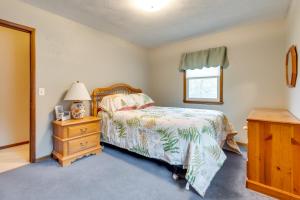 a bedroom with a bed and a dresser and a window at Clear Lake Vacation Home Rental - Pet Friendly! in Clear Lake