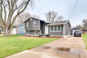 a black house with a car parked in the driveway at Clear Lake Vacation Home Rental - Pet Friendly! in Clear Lake