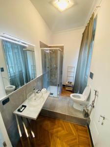 a bathroom with a sink and a toilet at ELEGANT ROOMS PARIOLI in Rome