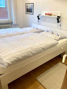 Postel nebo postele na pokoji v ubytování Dünenschlösschen 22