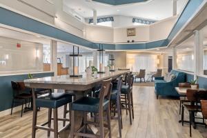 a dining room with a large table and chairs at The Grand Hotel in Ogunquit