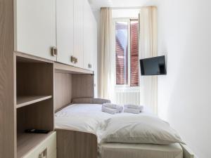 Postel nebo postele na pokoji v ubytování FCR Rome Apartments Gracchi Vatican