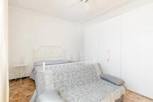 Postel nebo postele na pokoji v ubytování Spaziosa Matrimoniale nel centro di Modena