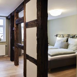 a room with a couch and a bed in it at Fachwerk-Romantik am Dom in Fulda