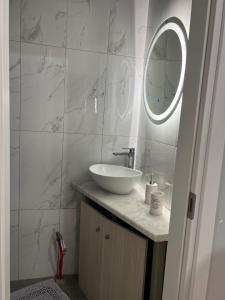 a white bathroom with a sink and a mirror at Luxury Villa Esmeralda in Sozopoli +11 photos