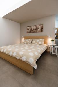 מיטה או מיטות בחדר ב-Maison du Mathilda