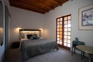 Postel nebo postele na pokoji v ubytování PHOENIX maison d'hôtes & SPA