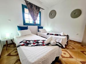 Postel nebo postele na pokoji v ubytování Cactus Living