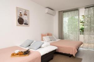 Posteľ alebo postele v izbe v ubytovaní Apartment Bitacora FULLY RENOVATED 2023 + 33 fotografií