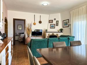 a living room with a couch and a table at Vivalidays Casa Ricardo in Sant Cebrià de Vallalta