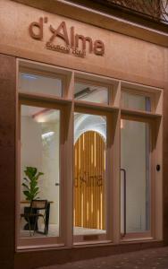 a window of a building with a sign on it at d'ALMA Boutique Hotel in Porto