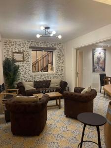 a large living room with couches and a table at Villa Mirroir en Champagne, jusque 10 voyageurs in Boursault