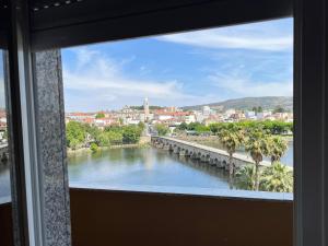 a view of a river from a window at Grande Hotel Dom Dinis in Mirandela +25 photos