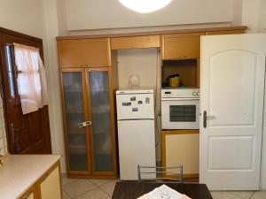 Kuchyň nebo kuchyňský kout v ubytování Upper Neighbourhood + 7 fotografií