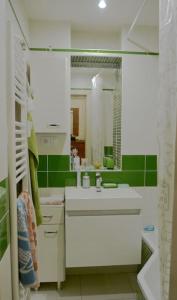 a bathroom with a sink and a mirror at Apartment Letna near the city center in Košice