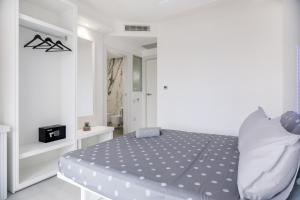 Postel nebo postele na pokoji v ubytování crabonaxa suites