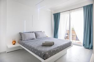 Postel nebo postele na pokoji v ubytování crabonaxa suites + 22 fotografií