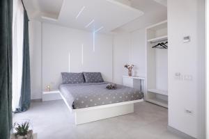 Postel nebo postele na pokoji v ubytování crabonaxa suites